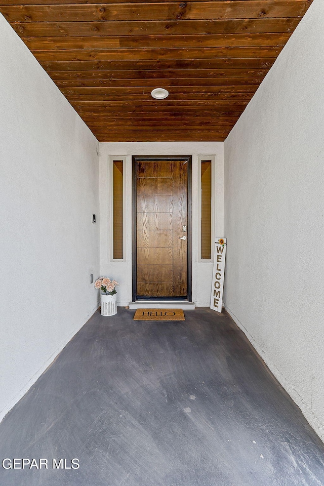 1725 Eased St, El Paso, TX 79928 - doorway to property featuring stucco siding