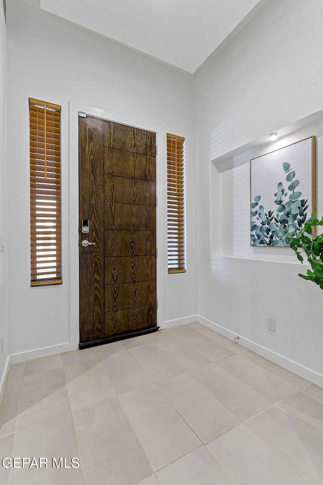 1725 Eased St, El Paso, TX 79928 - entrance foyer with light tile patterned flooring and baseboards