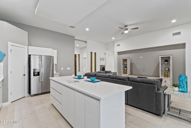 1725 Eased St, El Paso, TX 79928 - kitchen with white cabinetry, light countertops, modern cabinets, a ceiling fan, and stainless steel fridge