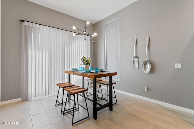 1725 Eased St, El Paso, TX 79928 - dining space featuring light tile patterned floors, an inviting chandelier, and baseboards