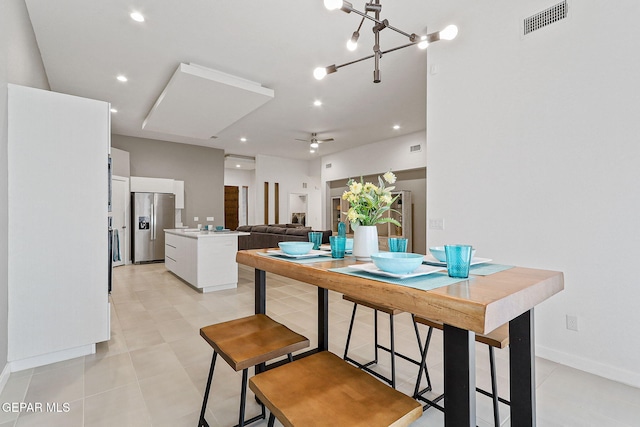 1725 Eased St, El Paso, TX 79928 - dining space featuring light tile patterned flooring, visible vents, ceiling fan, and baseboards