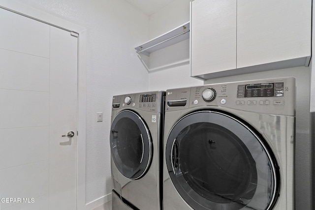 1725 Eased St, El Paso, TX 79928 - washroom with cabinet space and washer and clothes dryer