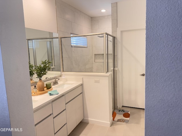 1725 Eased St, El Paso, TX 79928 - bathroom featuring double vanity, a tile shower, tile patterned floors, and a sink