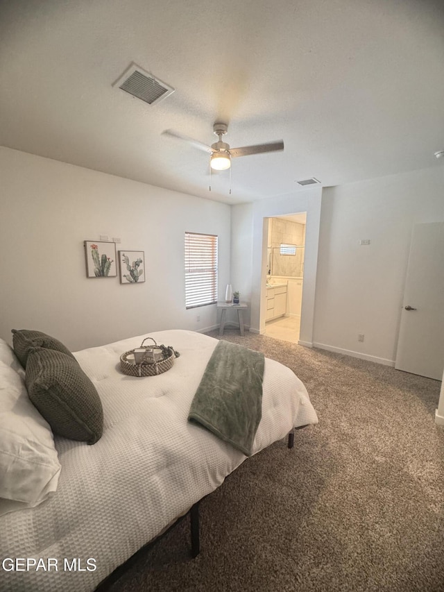 1725 Eased St, El Paso, TX 79928 - bedroom with baseboards, visible vents, ensuite bath, and carpet