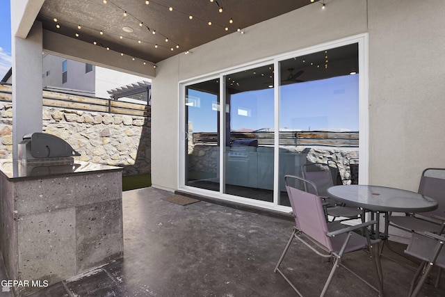 view of patio featuring outdoor dining space and exterior kitchen
