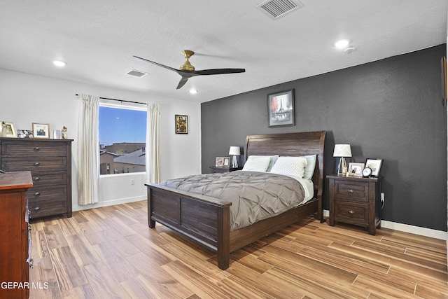 bedroom with recessed lighting, visible vents, and light wood-style flooring