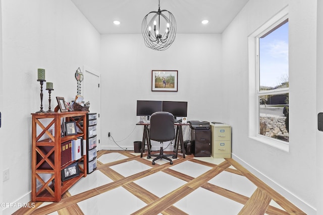 office space with baseboards, recessed lighting, and an inviting chandelier