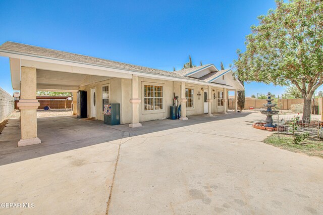 916 Mike Maros St, Fabens, TX 79838 - ranch-style house featuring a shingled roof, stucco siding, and fence
