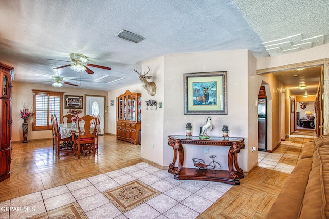 916 Mike Maros St, Fabens, TX 79838 - interior space featuring a textured ceiling, visible vents, a ceiling fan, and baseboards