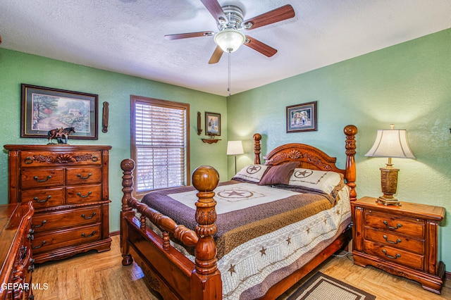 916 Mike Maros St, Fabens, TX 79838 - bedroom featuring a textured ceiling, a textured wall, ceiling fan, and baseboards