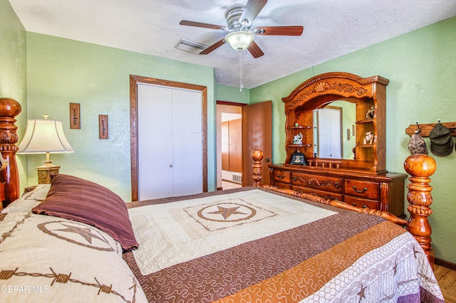 916 Mike Maros St, Fabens, TX 79838 - bedroom with baseboards, wood finished floors, a textured ceiling, and a textured wall