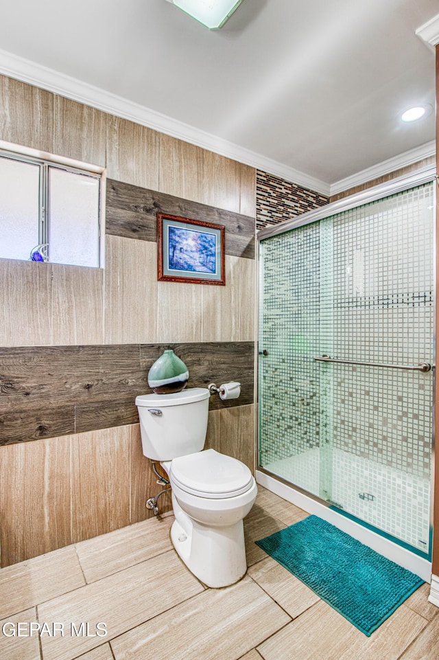 916 Mike Maros St, Fabens, TX 79838 - full bath with wood walls, toilet, crown molding, and a shower stall