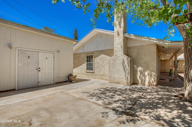 916 Mike Maros St, Fabens, TX 79838 - back of property with a patio and stucco siding