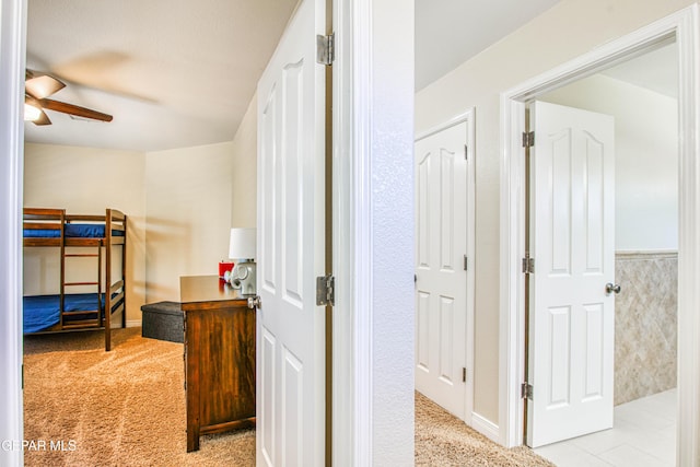 bedroom with ceiling fan and carpet