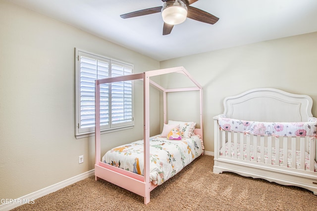 carpeted bedroom with baseboards and ceiling fan