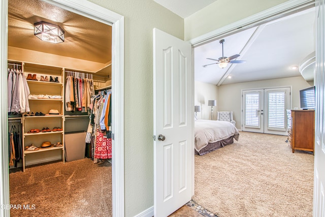 bedroom featuring french doors, carpet, ceiling fan, and access to outside
