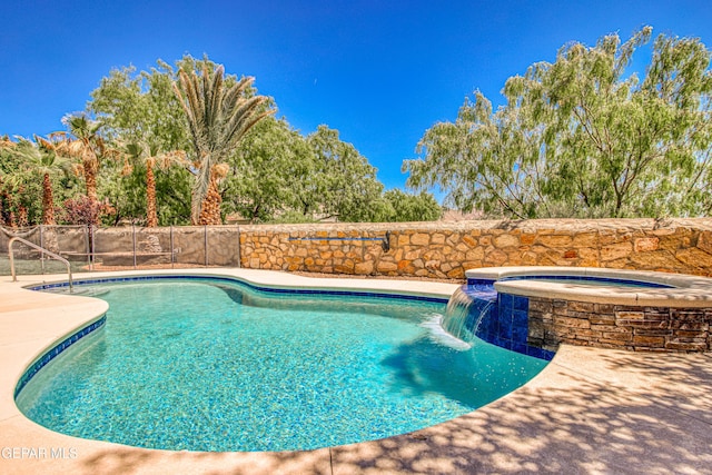 view of swimming pool featuring a fenced in pool, an in ground hot tub, fence, and a patio area