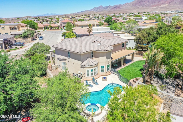 birds eye view of property featuring a mountain view and a residential view