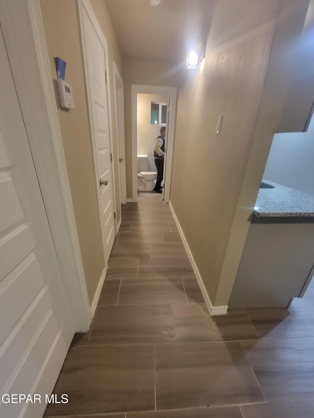 11531 Ernest Rd, Socorro, TX 79927 - hall with wood finished floors and baseboards