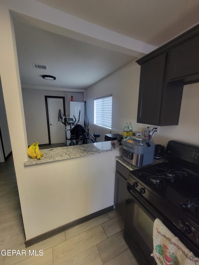11531 Ernest Rd, Socorro, TX 79927 - kitchen with black gas range oven