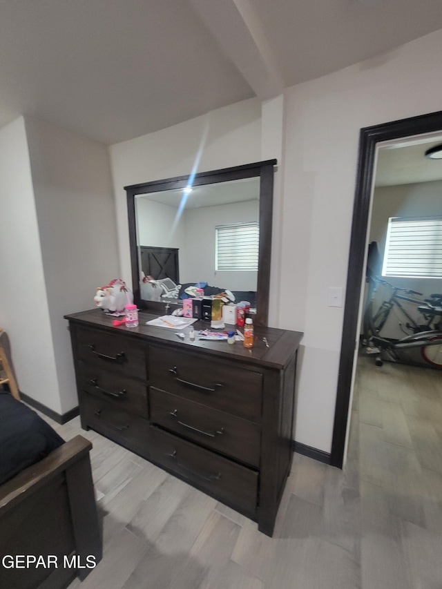 11531 Ernest Rd, Socorro, TX 79927 - bedroom featuring an office area, baseboards, and light wood-style floors