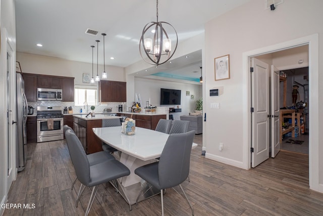 12244 Desert Snow Ct, El Paso, TX 79938 - dining space with an inviting chandelier, visible vents, recessed lighting, and dark wood finished floors