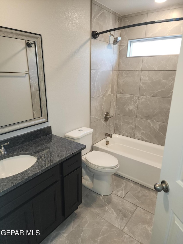 full bathroom with shower / bath combination, vanity, and toilet
