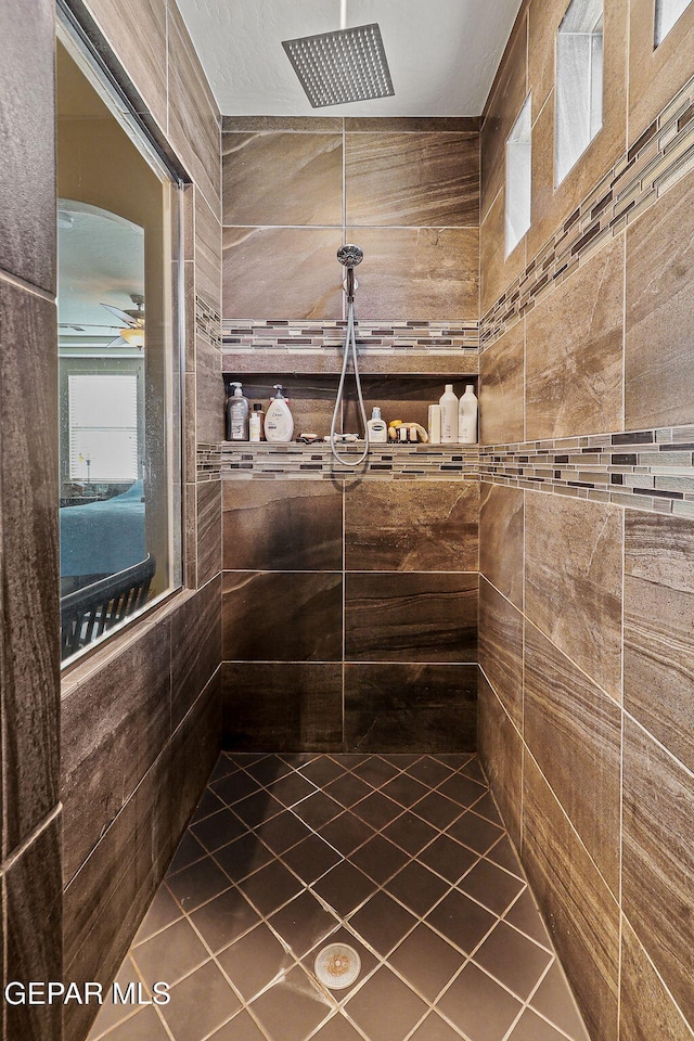 full bathroom featuring tiled shower