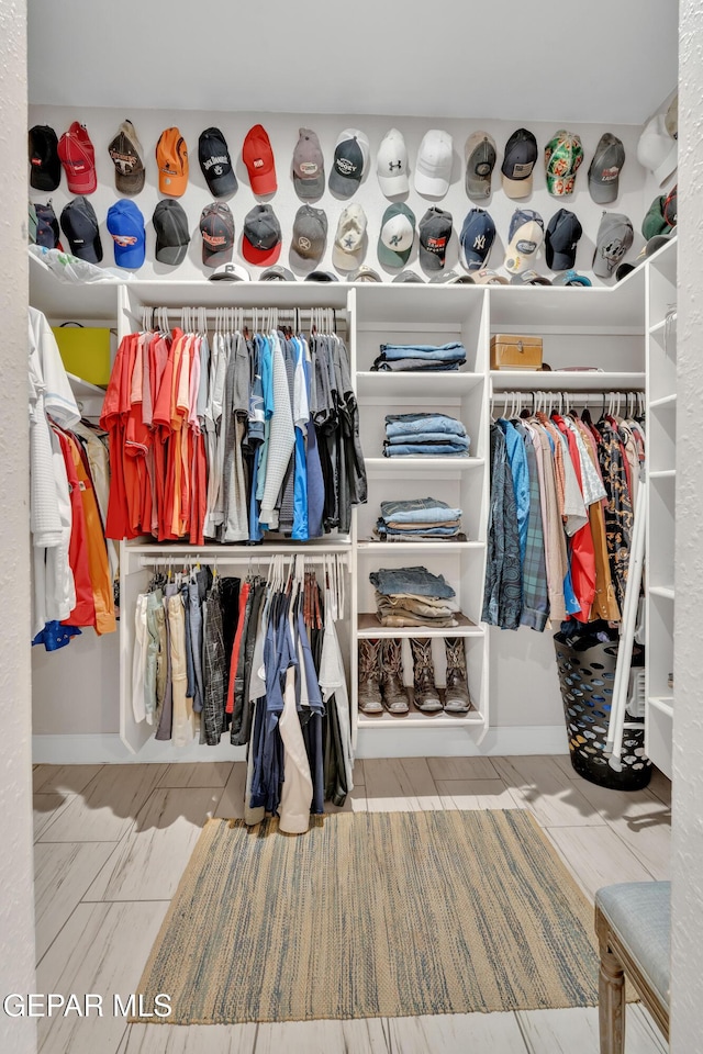 spacious closet featuring tile patterned floors