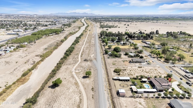 birds eye view of property featuring a mountain view
