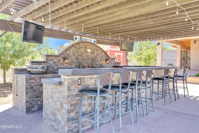 view of patio / terrace featuring outdoor dry bar
