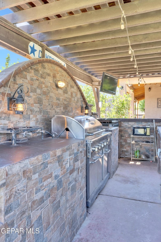 view of patio with exterior kitchen