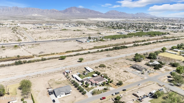 bird's eye view featuring view of desert, a mountain view, and a rural view