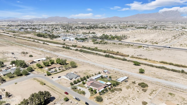 bird's eye view with a mountain view, a rural view, and view of desert