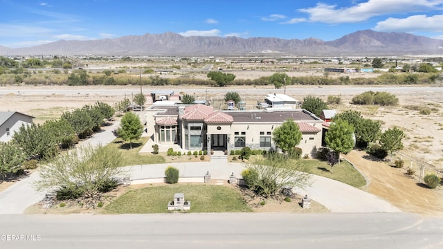 birds eye view of property with a mountain view