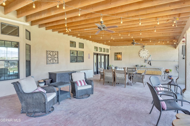 view of patio with an outdoor living space, ceiling fan, and outdoor dining space