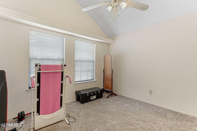 empty room featuring carpet floors, ceiling fan, and lofted ceiling
