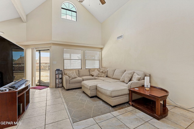 living room with high vaulted ceiling, a ceiling fan, light tile patterned flooring, and visible vents