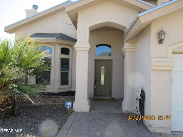 11233 Red Barrel Pl, El Paso, TX 79934 - property entrance featuring stucco siding and a chimney
