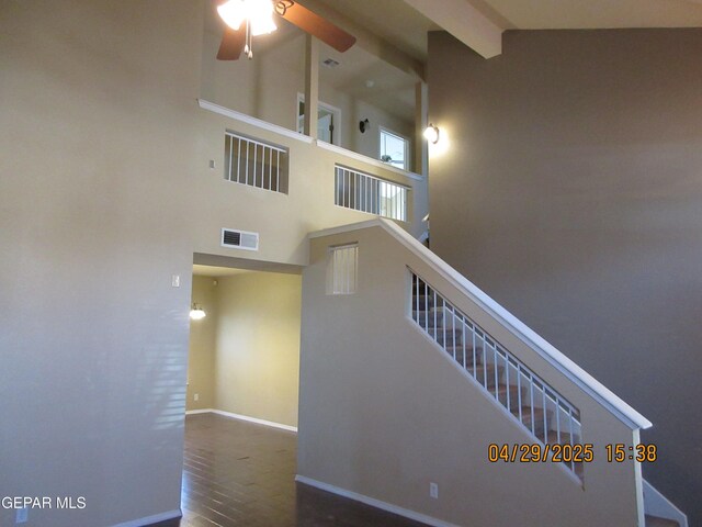 11233 Red Barrel Pl, El Paso, TX 79934 - stairs featuring visible vents, wood finished floors, beamed ceiling, baseboards, and ceiling fan