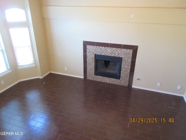 11233 Red Barrel Pl, El Paso, TX 79934 - unfurnished living room with baseboards and a fireplace