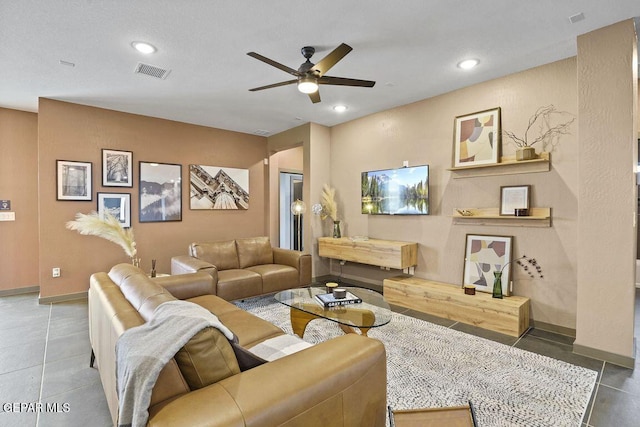 living area with ceiling fan, visible vents, baseboards, recessed lighting, and tile patterned floors