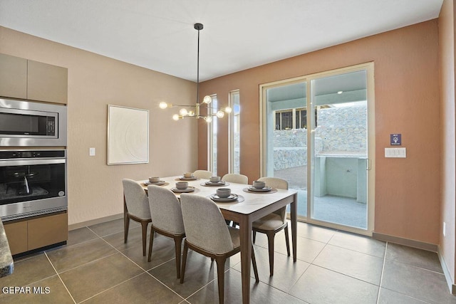 dining area with baseboards and light tile patterned floors