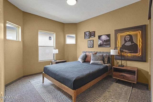 bedroom with carpet and baseboards