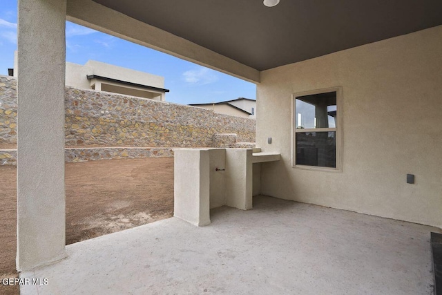 view of patio / terrace with a balcony
