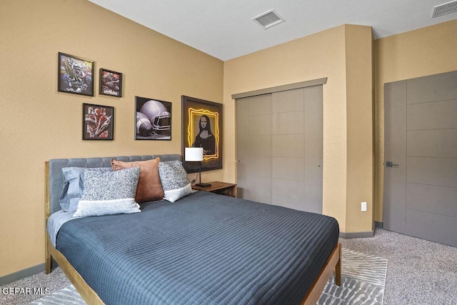 bedroom with visible vents, a closet, carpet flooring, and baseboards