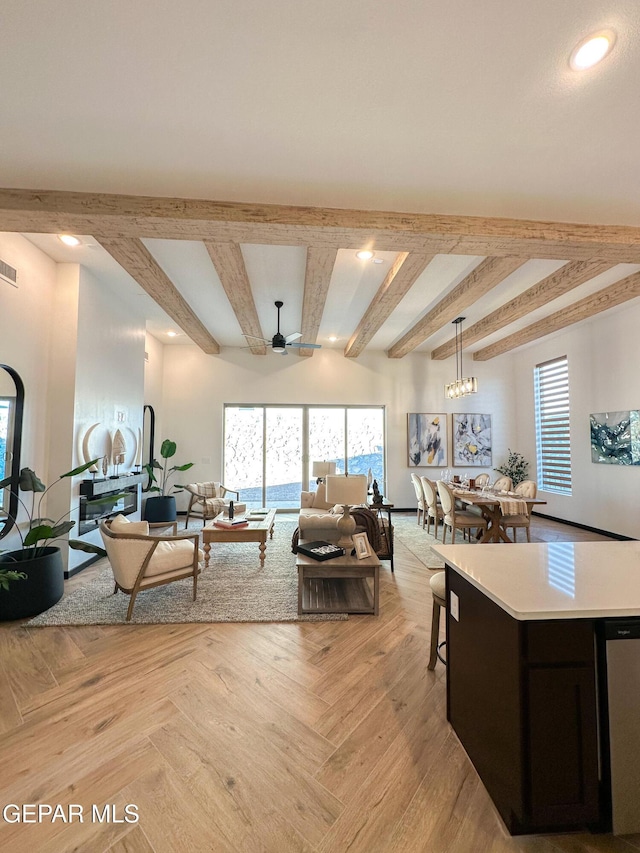 living room with recessed lighting, beam ceiling, and plenty of natural light