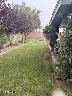 view of yard with fence