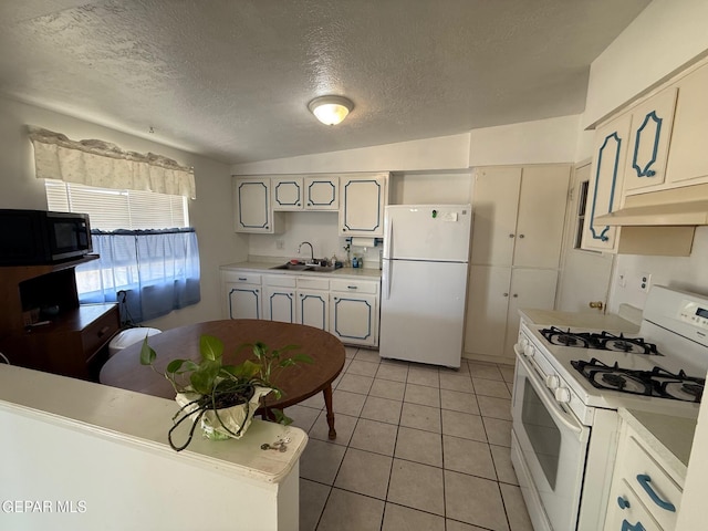 kitchen with white appliances, a sink, under cabinet range hood, a textured ceiling, and light countertops