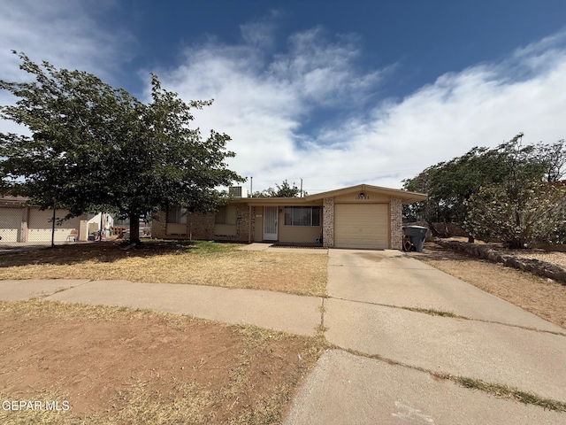 view of front of house featuring brick siding, concrete driveway, and an attached garage